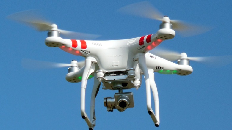 A quadcopter in operation with a digital camera mounted