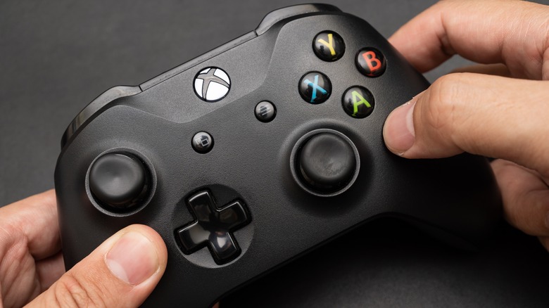 Someone holding Xbox controller