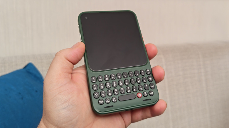 Man holding a Clicks Communicator