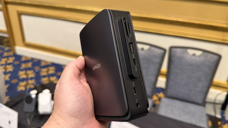 Man holding an Anker docking station