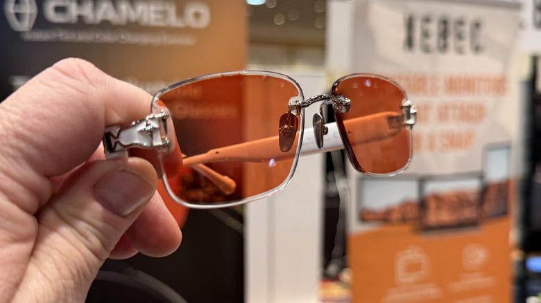 man holding sunglasses