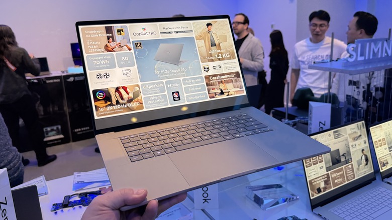 Man holding Asus Zenbook A16