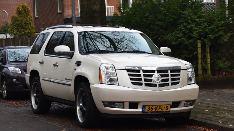 white 2008 Cadillac Escalade parked on the street