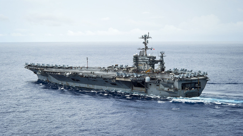 Aircraft carrier at Sea with aircraft onboard