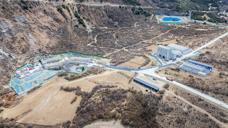 Aerial view of a hydropower industrial complex along the Yarlung Tsangpo river