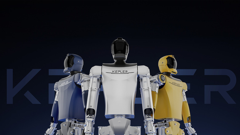 Three Kepler Robotics robots stand next each other against a black background.