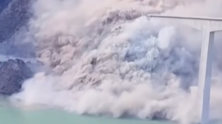 The Shuangjiangkou Hongqi Bridge collapsing in a cloud of dust