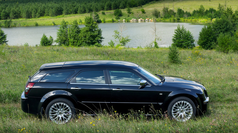 Chrysler 300C in countryside in grass