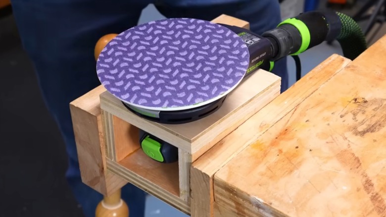 Orbital sander in a sanding station jig