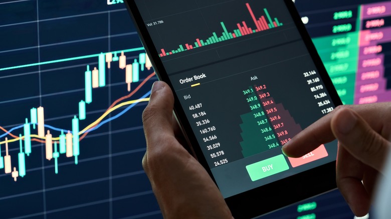 crypto trader using their phone