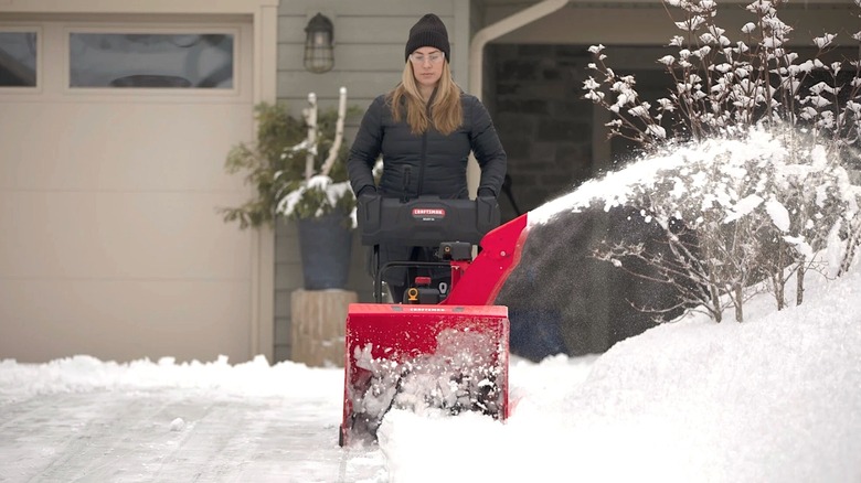 Person using Craftsman snow blower
