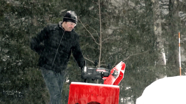 Person using Craftsman snow blower