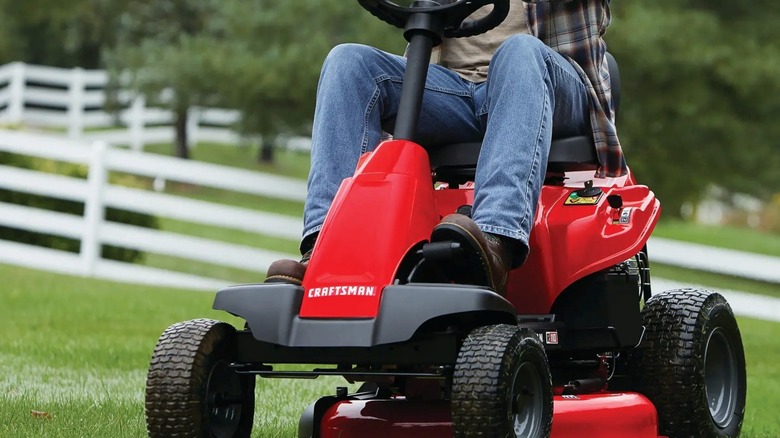 A Craftsman riding mower doing work.