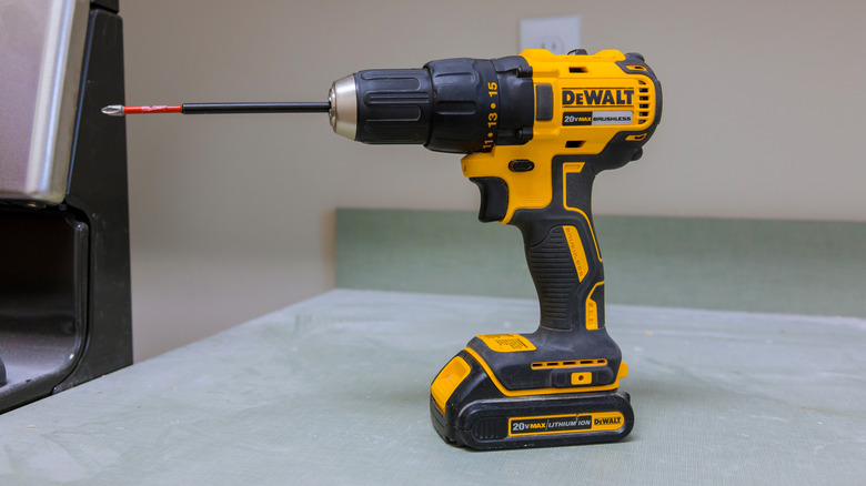 Dewalt 20V Max cordless impact driver drill on a table