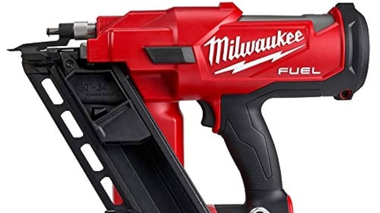 a close up of a Milwaukee framing nailer