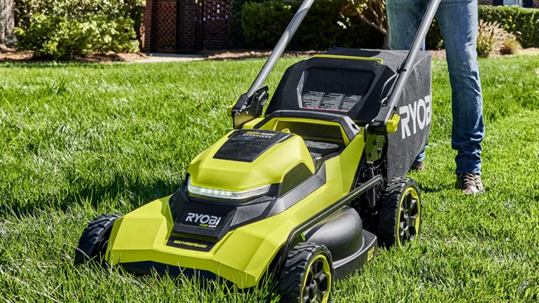 A Ryobi 40V lawn mower on a lawn.