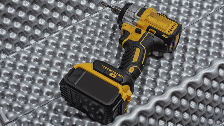 DeWalt tool on its side with thick battery