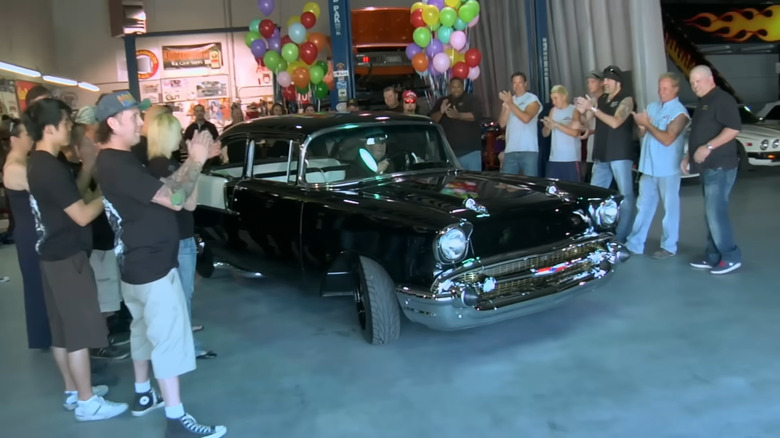 Old Man driving Custom 1957 Chevrolet 150