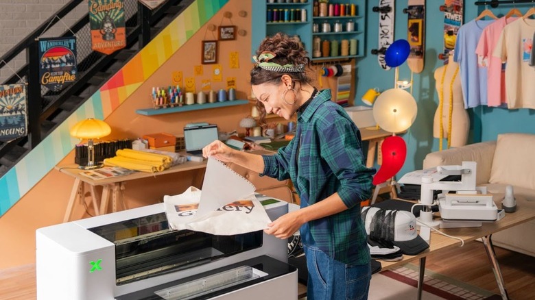 Woman using xTool apparel printer