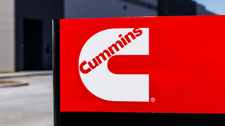 Close up shot of a sign with a red Cummins logo