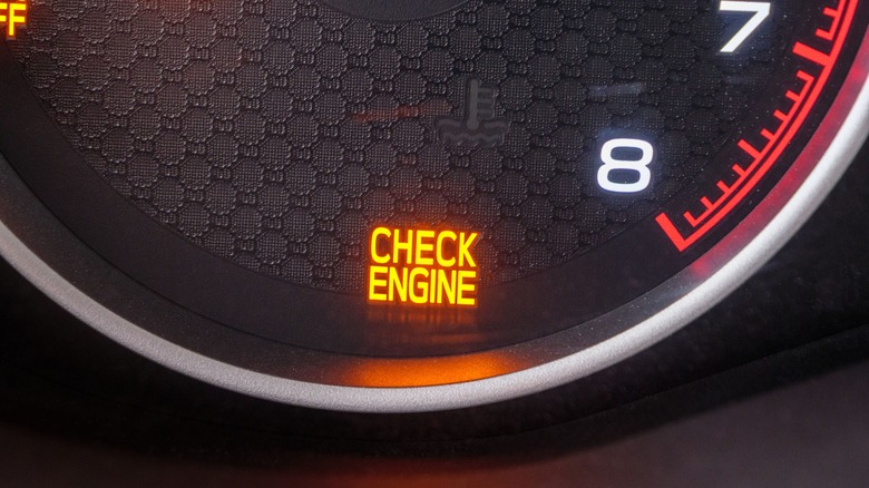 Close-up of check engine light on car