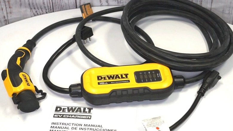 A portable DeWalt EV charger on a table.