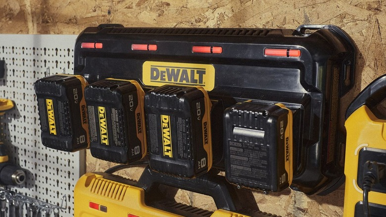 A DeWalt four-port charger attached to a wall