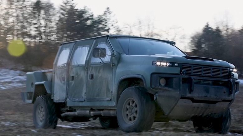 The Next Generation Tactical Vehicle-Hybrid (NGTV-H) driving on an unpaved road