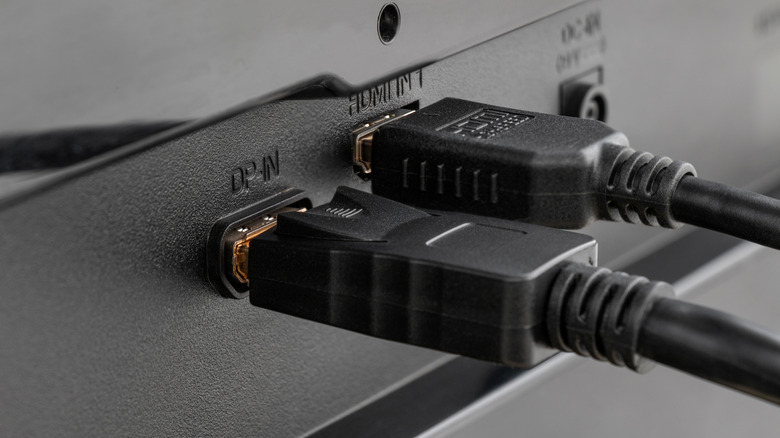 HDMI and DisplayPort cables connected to monitor