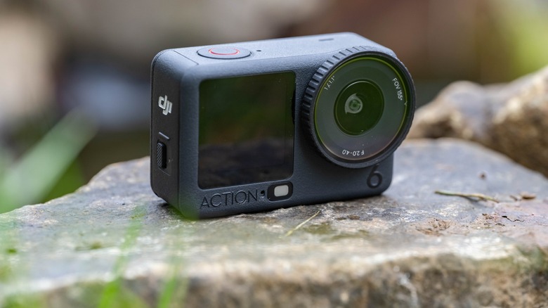 The DJI Osmo Action 6 sitting on a rock.