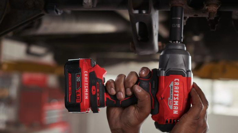 A man using a Craftsman tool