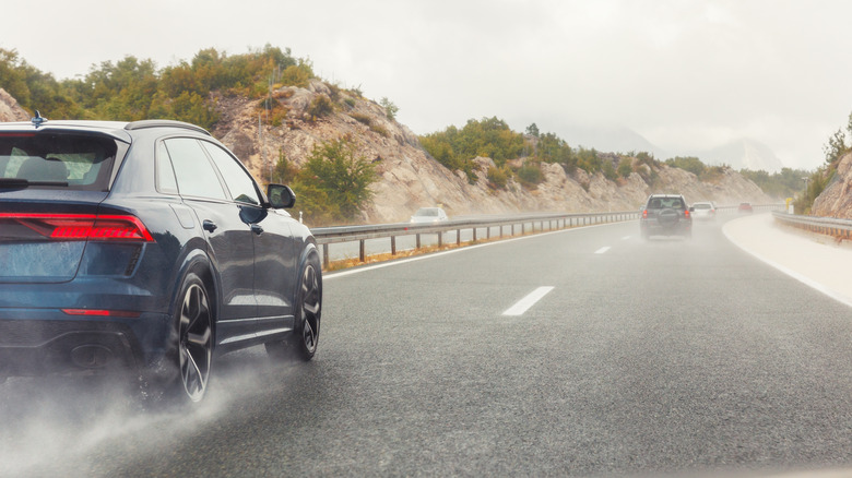 Cars driving on wet roads