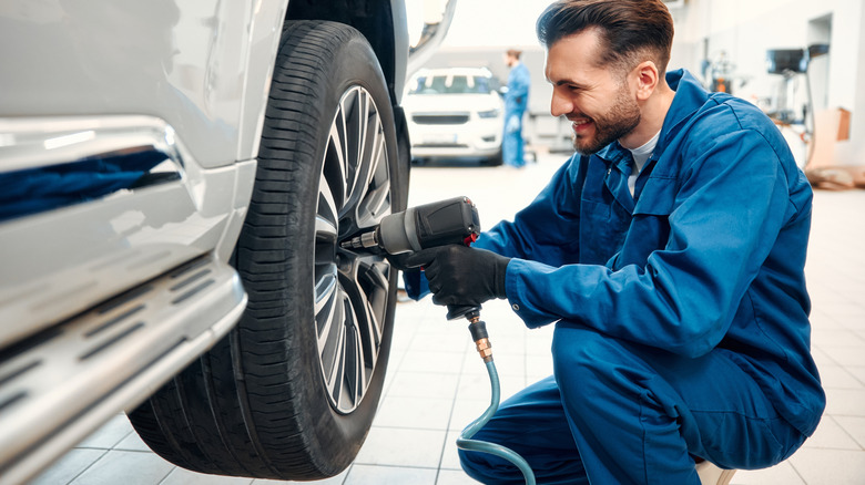 Mechanic working on the rear wheel