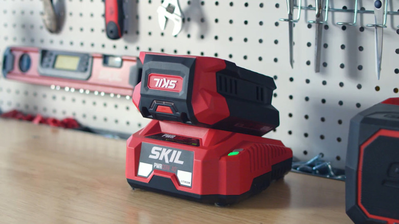 Skil battery connected to charger in the garage