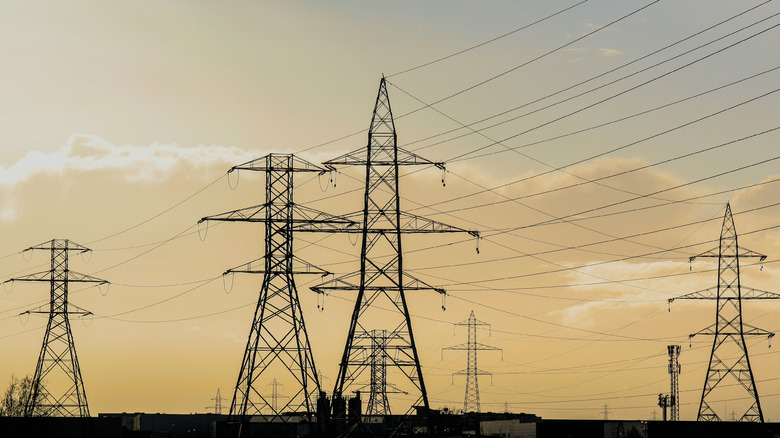 Several power-line towers silhouetted against the sky.