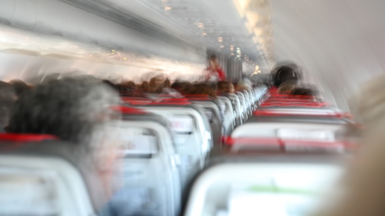 Blurry picture showing turbulence in an aircraft cabin