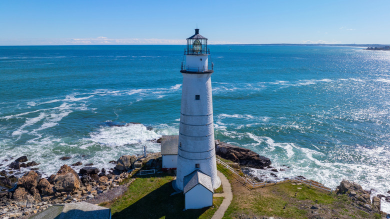 Wide view of the ocean in front of a lighthouse