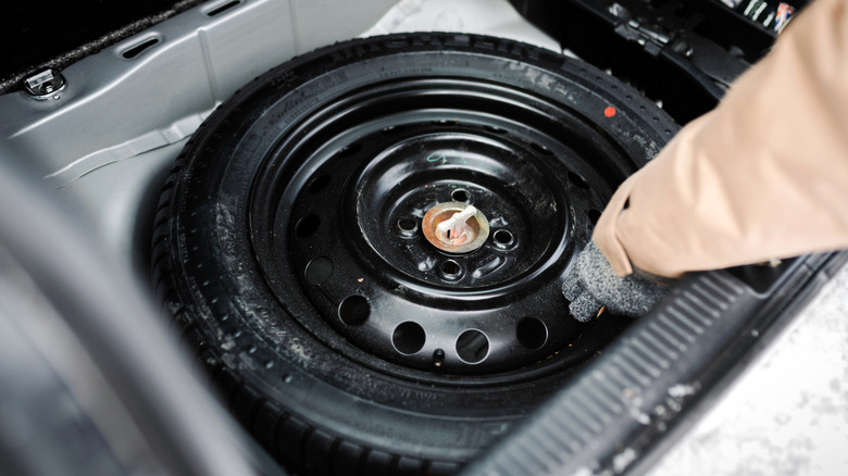 Spare tire in the trunk of a car