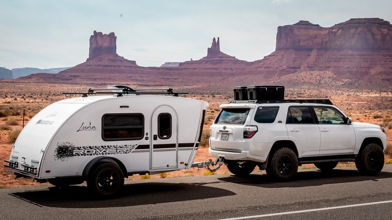 An inTech Luna tear drop travel trailer being towed through the southwest