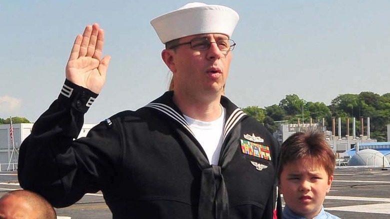 A sailor re-enlisting aboard the USS George Washington