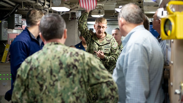 Sailors and civilians aboard the USS Maine (SSBN-741)