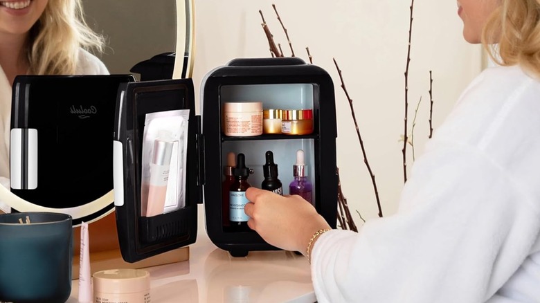 woman opening Cooluli USB fridge