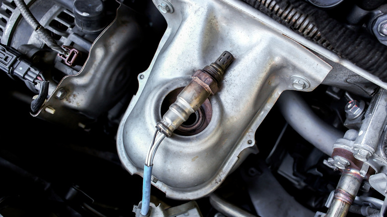 Oxygen sensor on top of car exhaust manifold