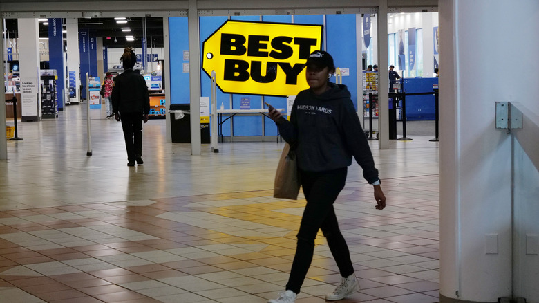 People walking by a Best Buy store in Brooklyn, New York