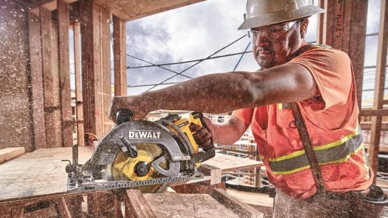 Construction worker using DeWalt Circular saw