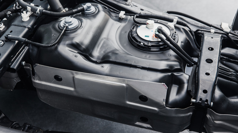 a gas tank attached to a vehicle chassis