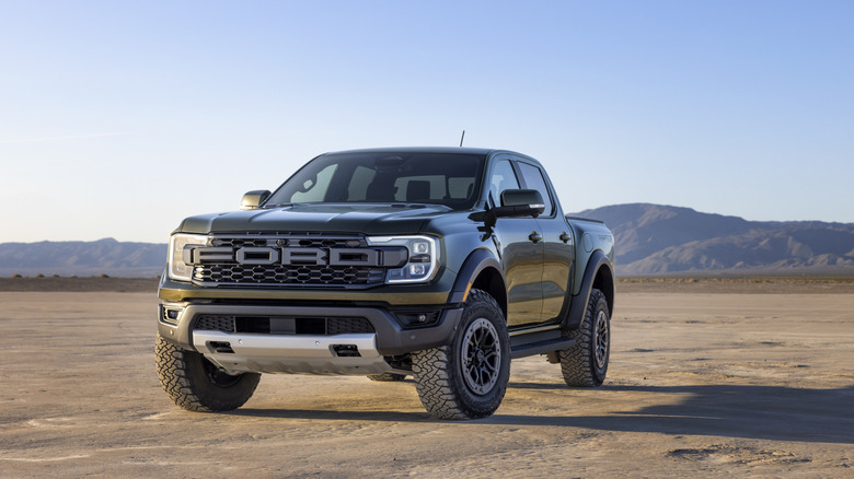 A green Ranger Raptor on a dirt surface