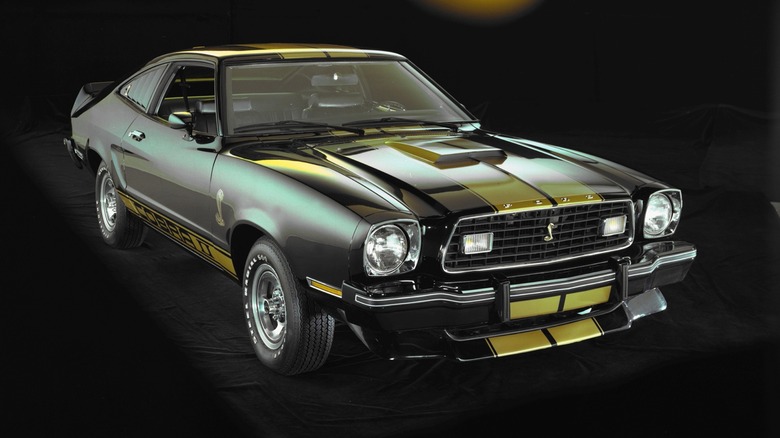 1977 Ford Mustang Cobra II, front right 3/4 view, black with yellow stripes