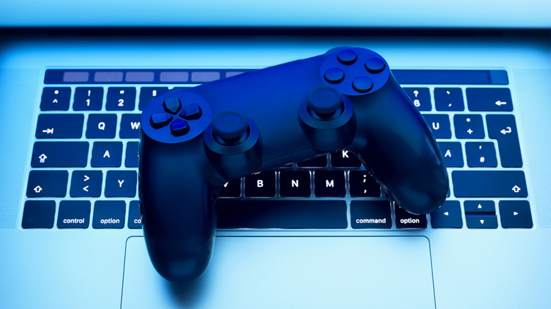 A laptop with an old PlayStation controller