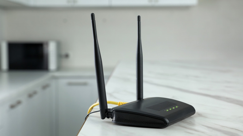 Black Wi-Fi router on kitchen table